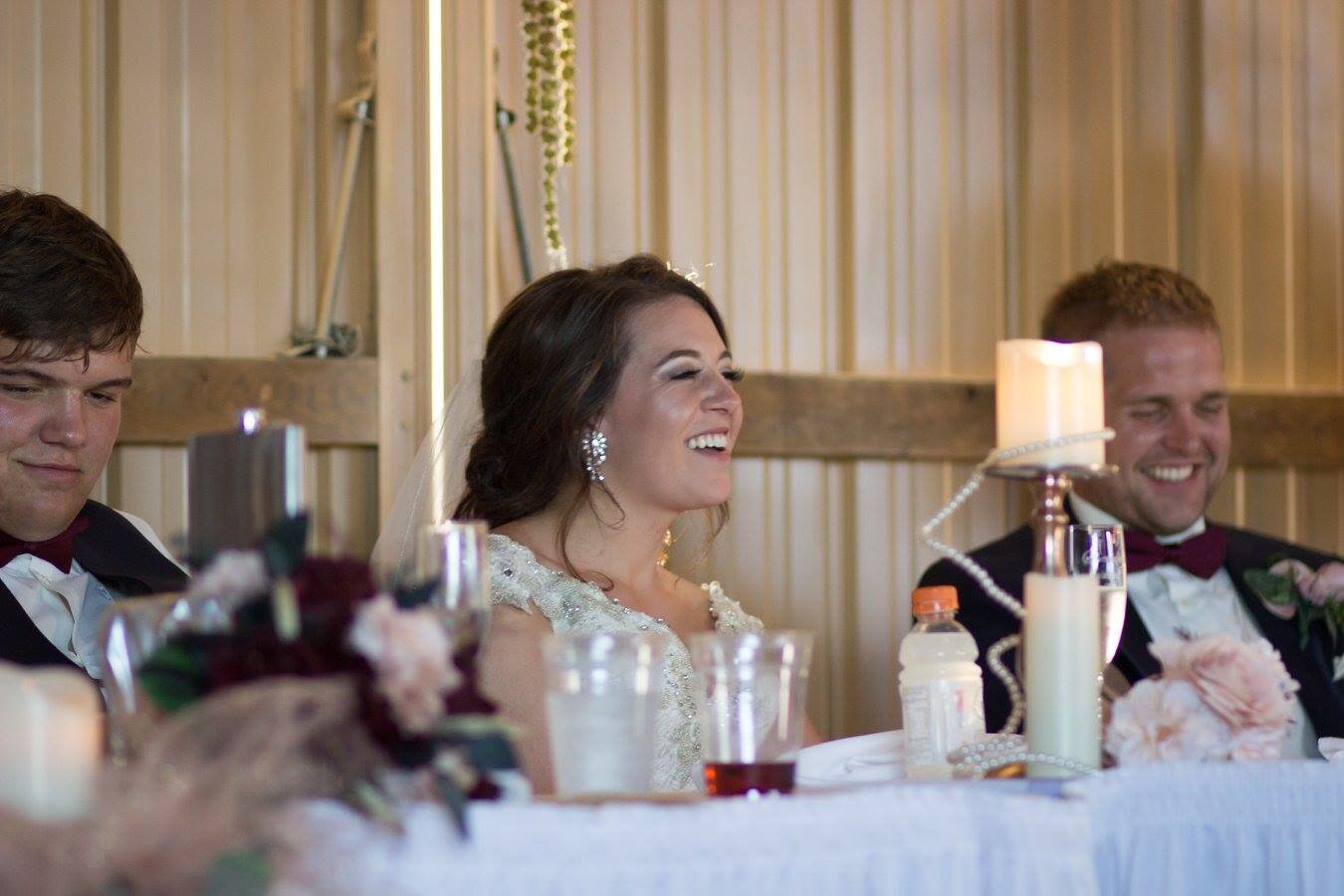 bride laughing at wedding reception