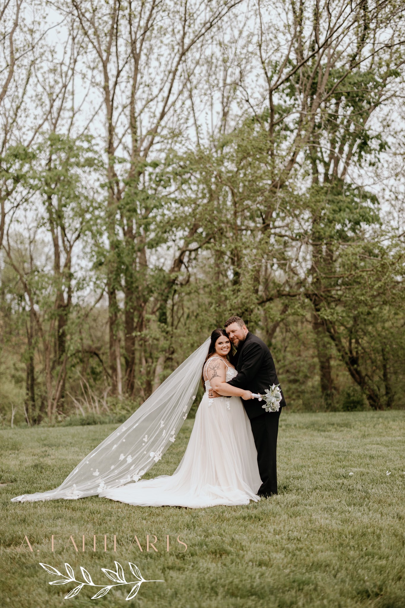 bride and groom hugging