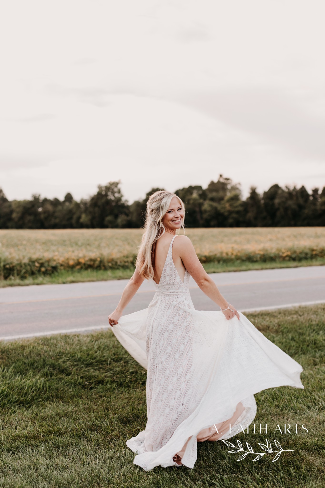 bride twirling in lace gown