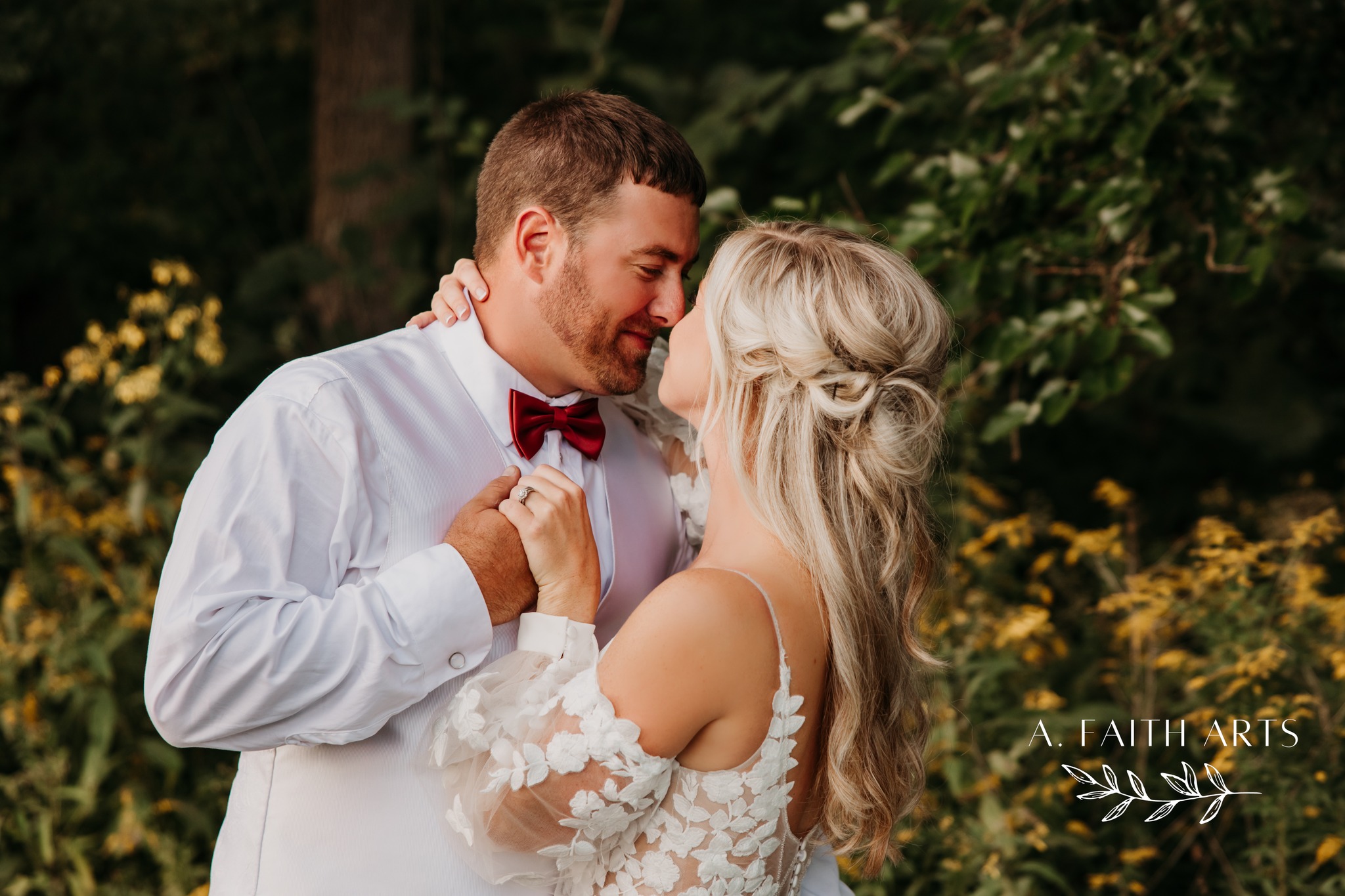 bride and groom holding hands and embracing
