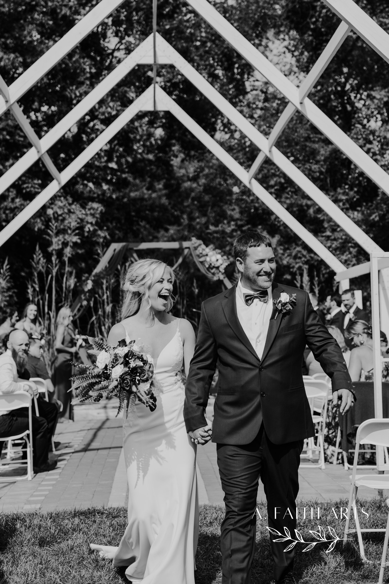 bride and groom walking down aisle after wedding ceremony