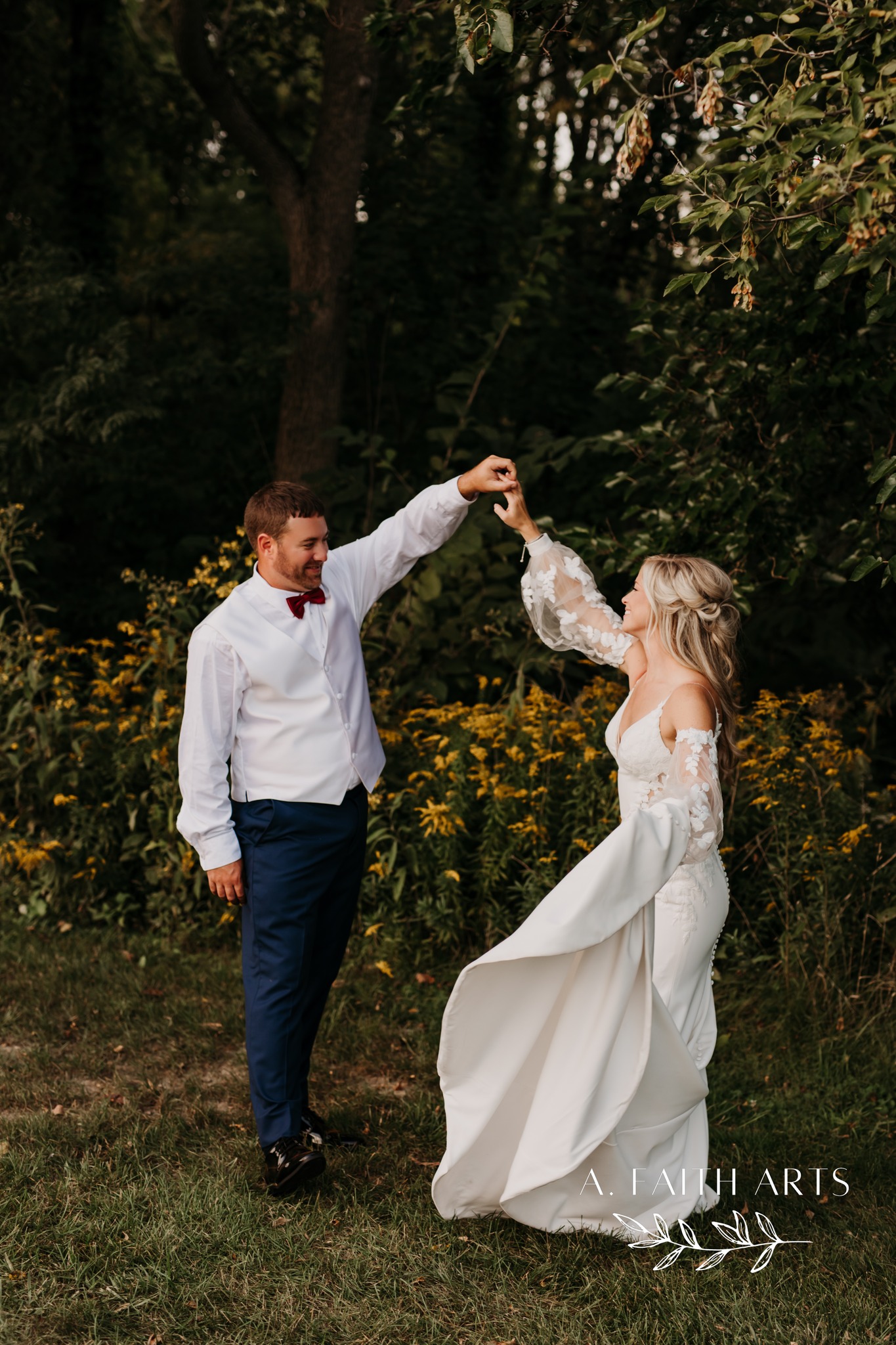 groom twirling bride