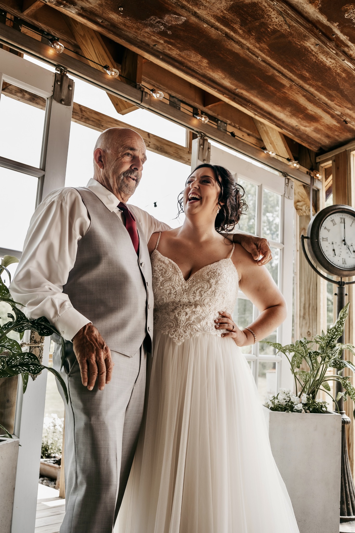 bride laughing with her father