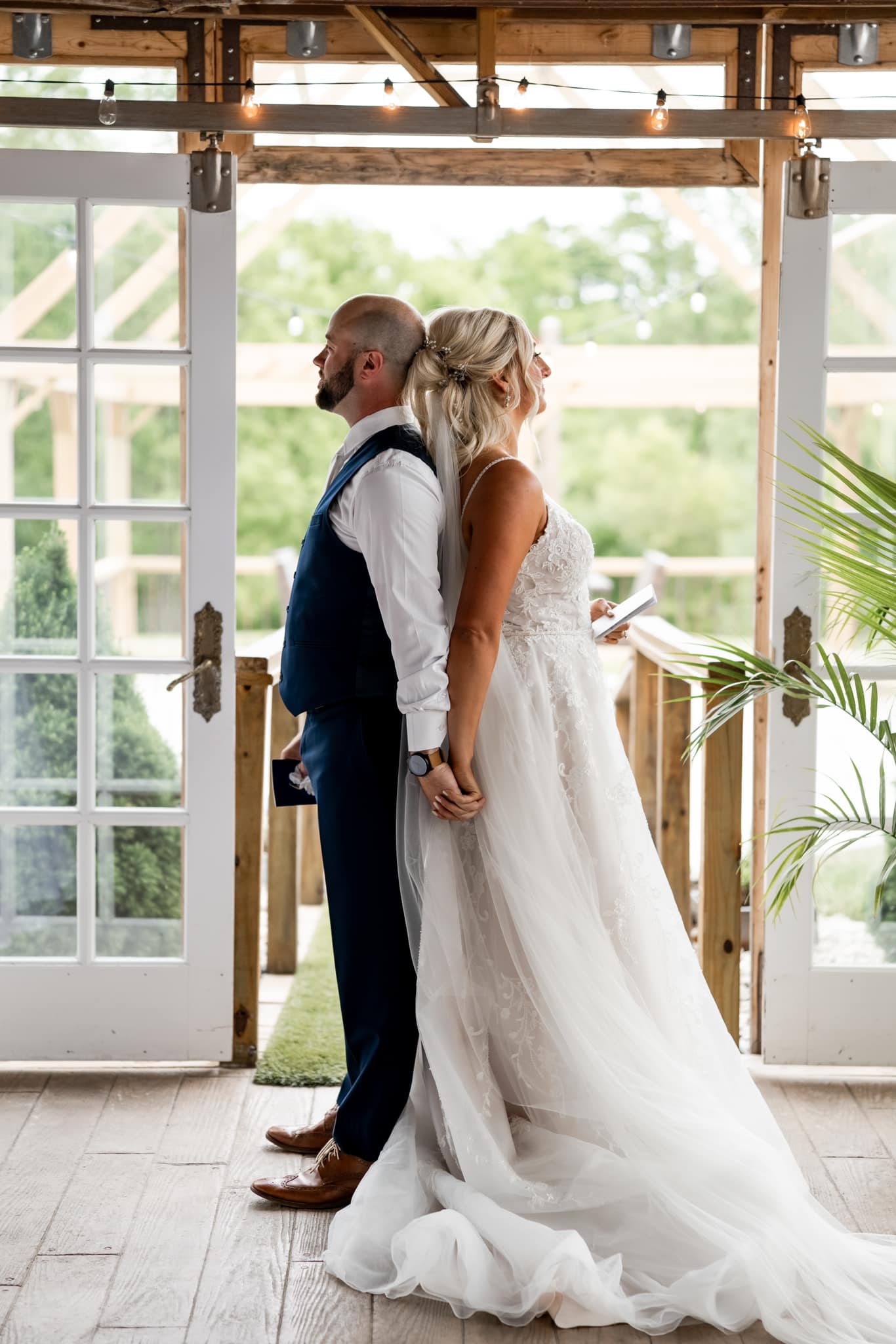bride and groom holding hands before first look