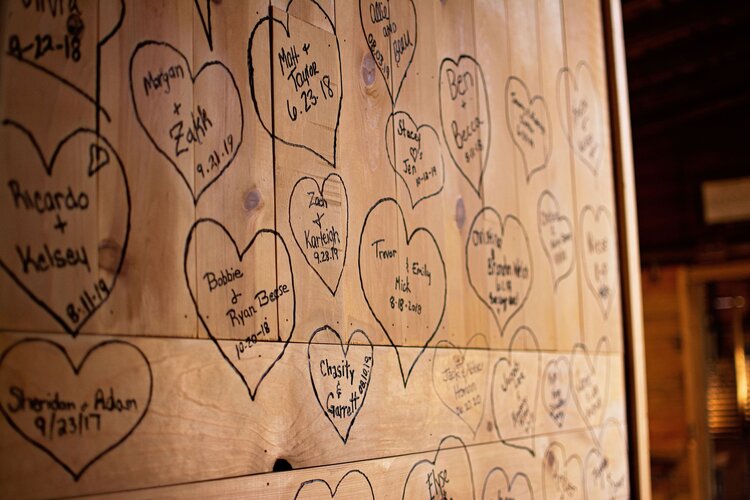 couples' names written on venue wall